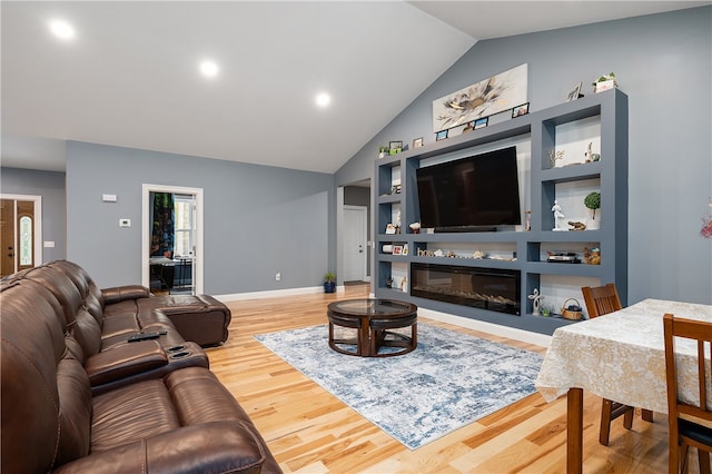 living room with lofted ceiling and wood-type flooring