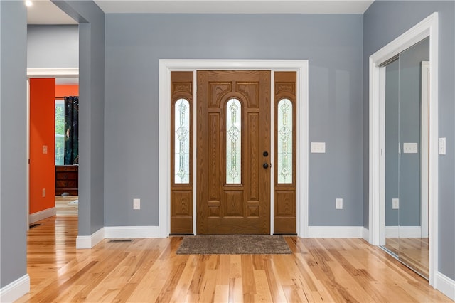 foyer with light hardwood / wood-style floors