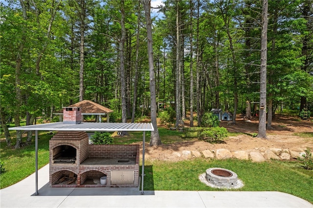 exterior space featuring an outdoor fire pit