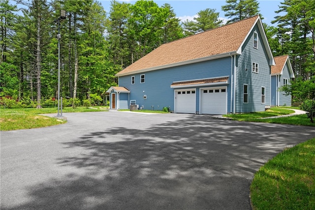 view of side of property featuring a garage