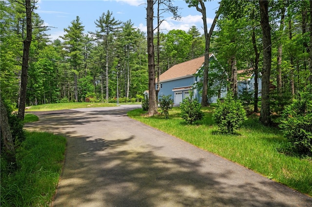 view of side of home featuring a garage