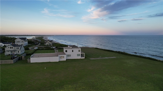 aerial view at dusk with a water view