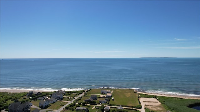 birds eye view of property with a view of the beach and a water view