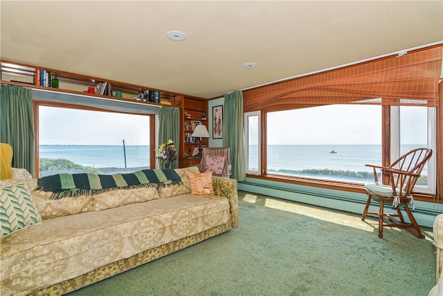 living room featuring a baseboard radiator, carpet, and a water view