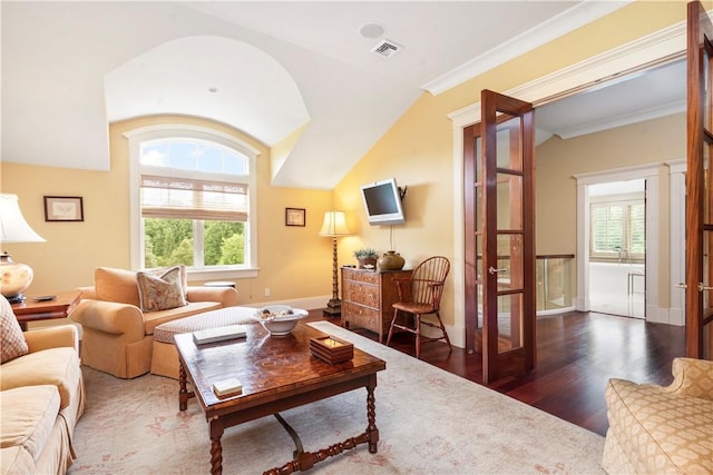 living room featuring visible vents, crown molding, baseboards, wood finished floors, and french doors