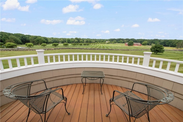 wooden deck featuring a yard