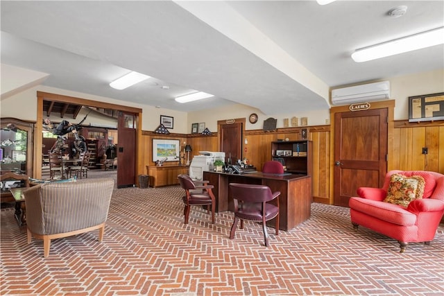 home office featuring a wall unit AC, wood walls, brick floor, and wainscoting