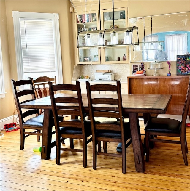 dining area with light hardwood / wood-style floors