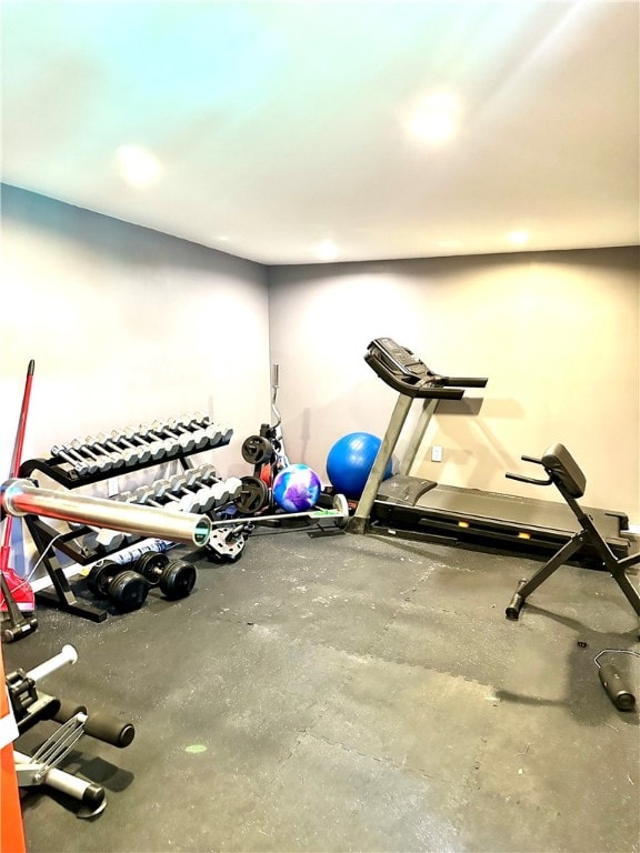 exercise area featuring concrete floors