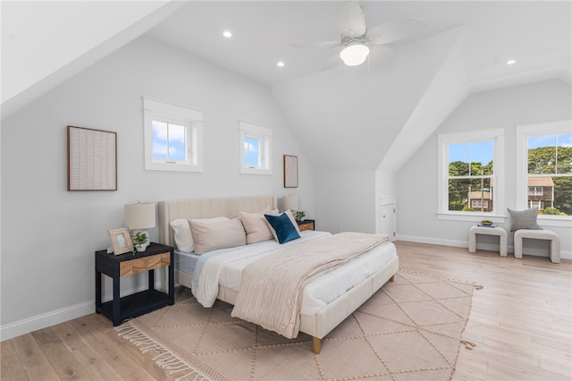 bedroom with lofted ceiling, light hardwood / wood-style flooring, and ceiling fan