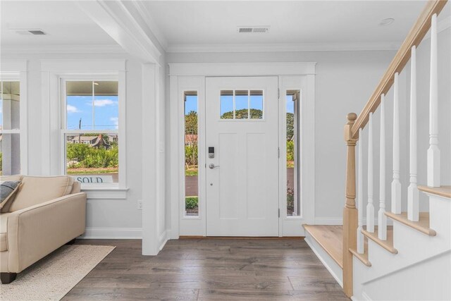 foyer with crown molding and dark hardwood / wood-style floors