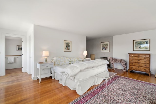 bedroom with hardwood / wood-style floors