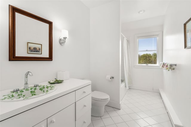 full bathroom featuring vanity, shower / tub combo, toilet, and tile patterned floors