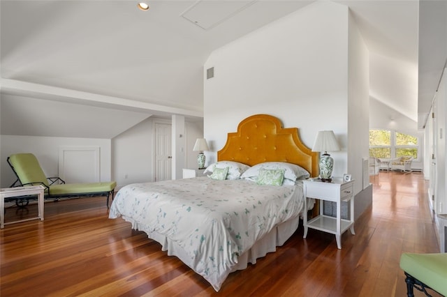 bedroom with hardwood / wood-style flooring and vaulted ceiling