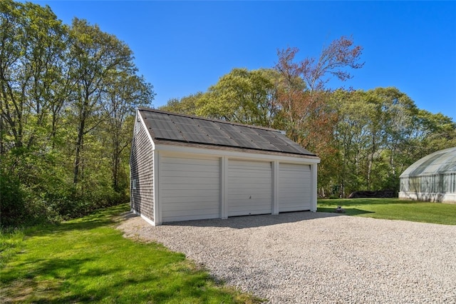 garage with a lawn