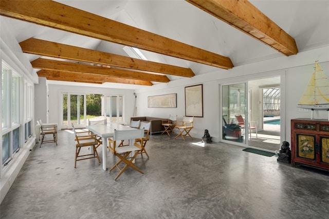 sunroom / solarium with beamed ceiling and a skylight