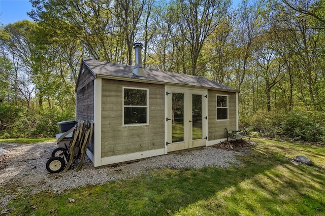 view of outbuilding with a yard