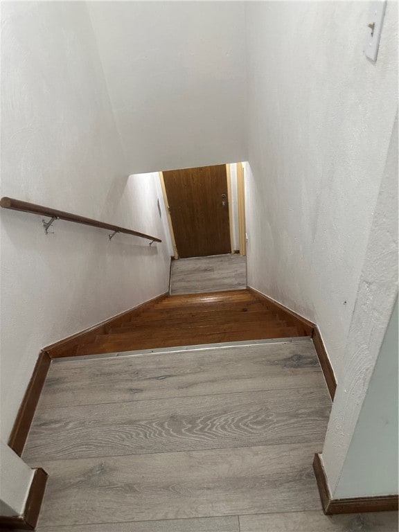 stairway featuring hardwood / wood-style flooring