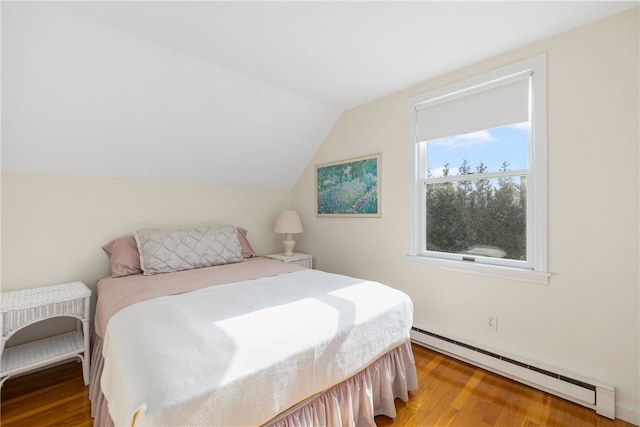 bedroom with light wood-type flooring, vaulted ceiling, and a baseboard radiator