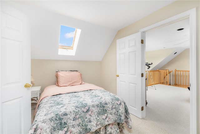 bedroom featuring carpet floors and lofted ceiling with skylight