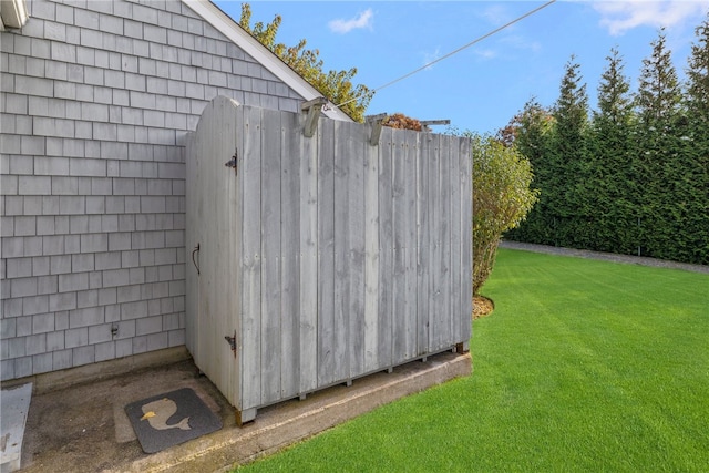 view of outbuilding featuring a yard