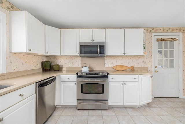 kitchen with white cabinetry and stainless steel appliances