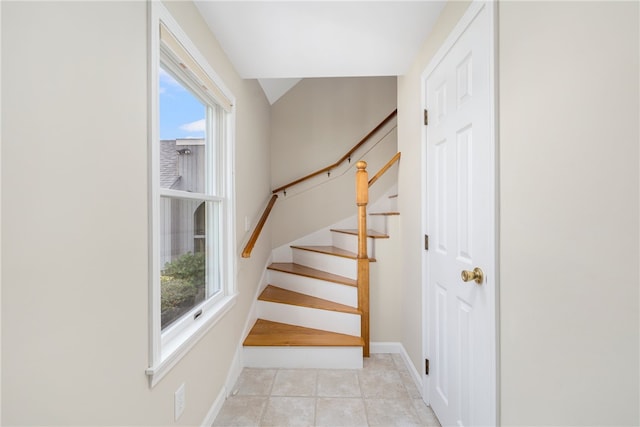 stairs with tile patterned flooring and plenty of natural light