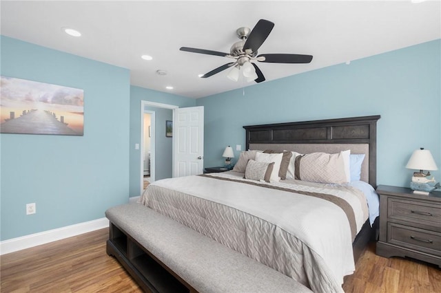 bedroom with hardwood / wood-style floors and ceiling fan