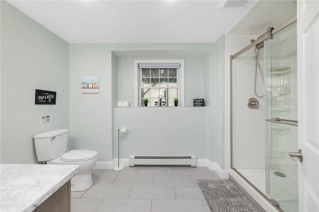 bathroom featuring vanity, toilet, baseboard heating, and a shower with shower door