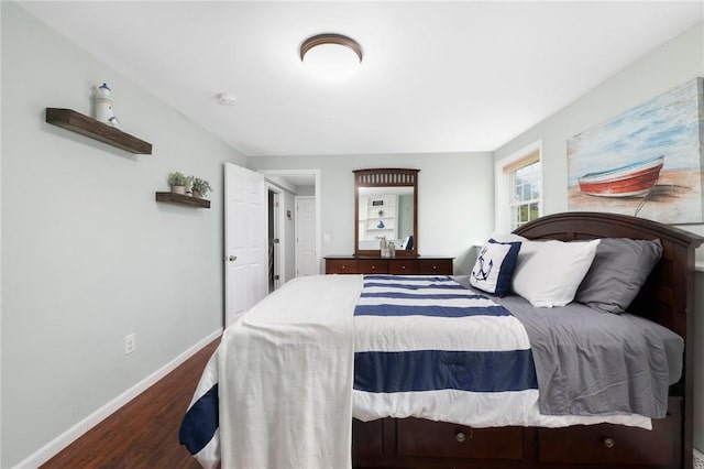 bedroom featuring dark hardwood / wood-style flooring