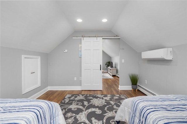 bedroom with lofted ceiling, a baseboard heating unit, dark hardwood / wood-style floors, a barn door, and a wall mounted AC