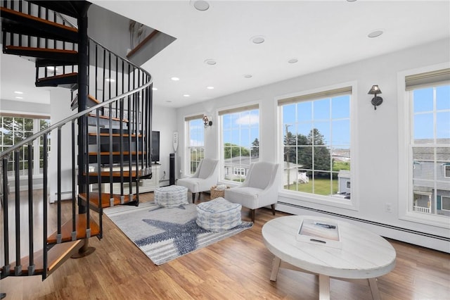 living room with hardwood / wood-style floors and a baseboard radiator