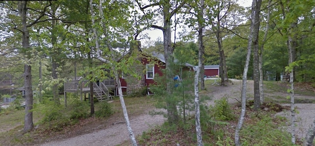 view of yard featuring a wooden deck