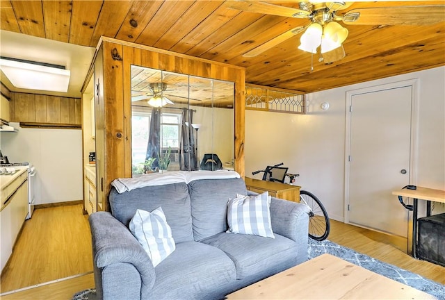 living room with wooden ceiling, ceiling fan, and light hardwood / wood-style flooring