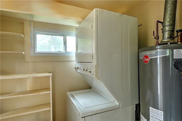 washroom with gas water heater and stacked washer and dryer