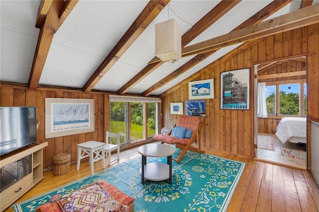 681 Corn Neck Rd, Block Island, RI 02807 - living area featuring wooden walls, plenty of natural light, hardwood / wood-style flooring, and a ceiling fan