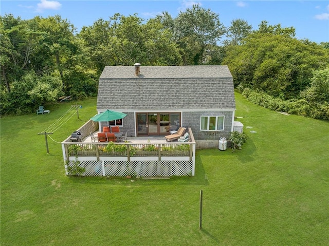 681 Corn Neck Rd, Block Island, RI 02807 - rear view of property featuring a yard, a wooden deck, roof with shingles, and a gambrel roof