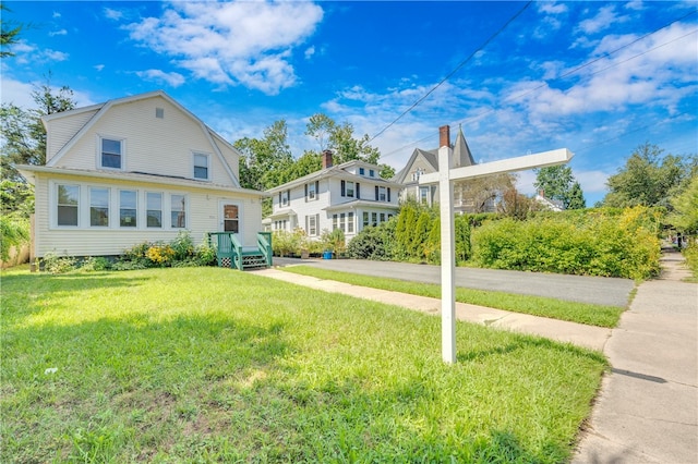 view of front of property with a front lawn