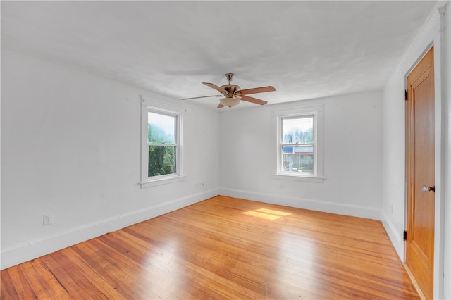 unfurnished room with ceiling fan and light hardwood / wood-style floors