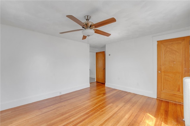 unfurnished room with ceiling fan and light hardwood / wood-style flooring