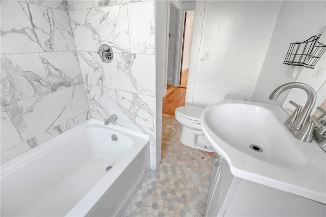 bathroom with wood-type flooring, sink, and toilet