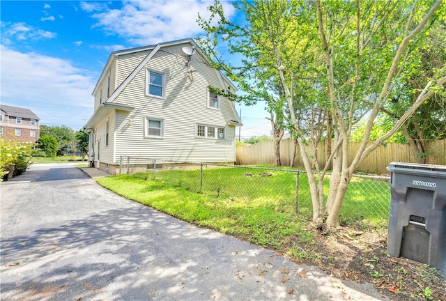 back of property featuring a yard