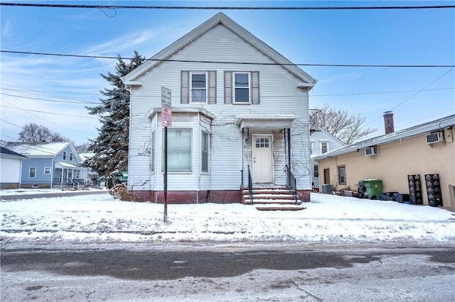 front of property featuring a wall mounted AC