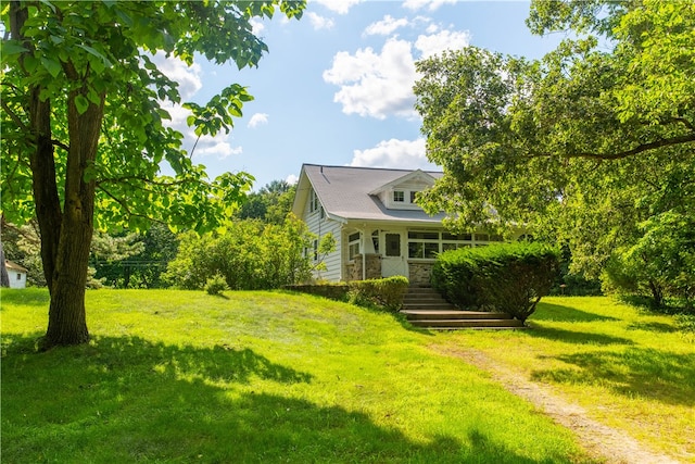 view of yard featuring covered porch