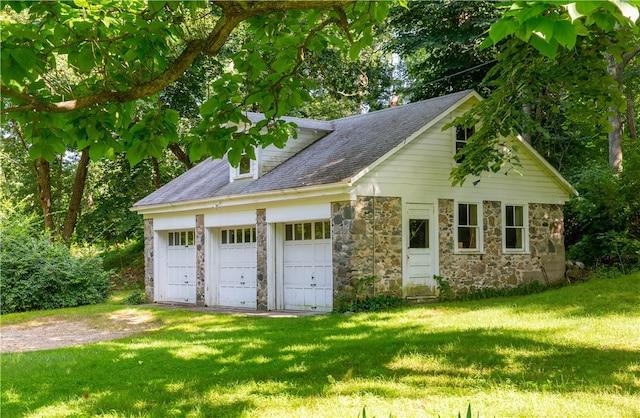 garage with a lawn