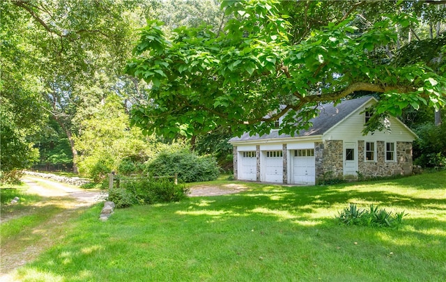 view of yard with a garage