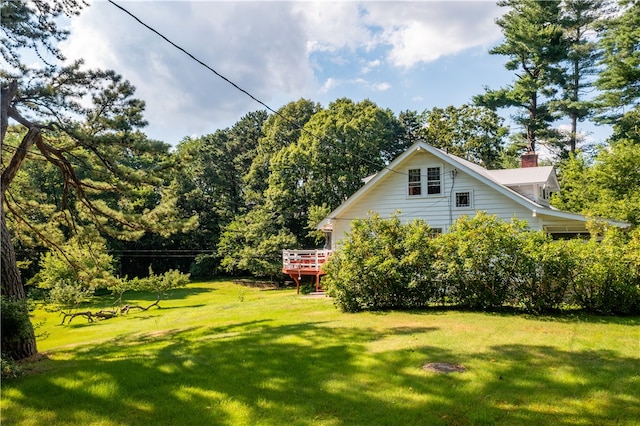 view of yard featuring a wooden deck