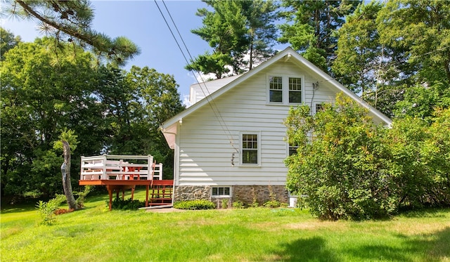 exterior space with a yard and a wooden deck