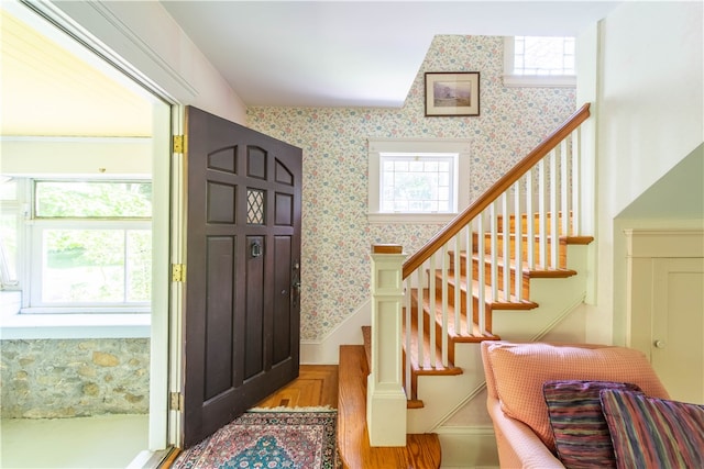 foyer entrance with wood-type flooring