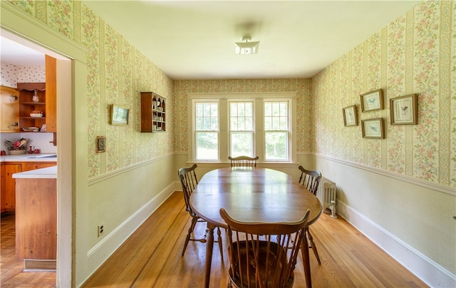 dining space featuring light wood-type flooring